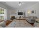 Spacious living room with fireplace, large TV, and a comfortable seating arrangement at 2012 Sterling Hill Dr, Fuquay Varina, NC 27526