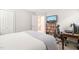 Bedroom with TV, bookcase, desk, and door to stairwell at 203 Lighthouse Way, Cary, NC 27511