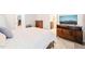 Cozy bedroom with neutral decor, dark wood furnishings, and adjacent bath at 203 Lighthouse Way, Cary, NC 27511