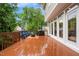 Enjoy outdoor living on this expansive deck, furnished with chairs, a grill, and easy access to the home's interior at 203 Lighthouse Way, Cary, NC 27511