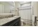 Bathroom featuring granite countertop, sink, toilet, and shower with curtain rod at 205 Sherman Pines Dr, Fuquay Varina, NC 27526