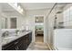 Modern bathroom featuring granite counters, double sinks and a glass enclosed shower at 205 Sherman Pines Dr, Fuquay Varina, NC 27526