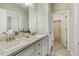 Bathroom featuring double sinks, granite countertops, and tiled floors at 205 Sherman Pines Dr, Fuquay Varina, NC 27526