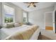 Bright bedroom with large windows, neutral tones, and ceiling fan at 205 Sherman Pines Dr, Fuquay Varina, NC 27526