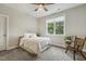Cozy bedroom with ceiling fan and window view of the green outdoors at 205 Sherman Pines Dr, Fuquay Varina, NC 27526