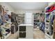 Spacious walk-in closet with custom shelving and storage for clothing and shoes at 205 Sherman Pines Dr, Fuquay Varina, NC 27526