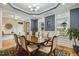 Well-lit dining room with beautiful hardwood floors and views of the outside at 205 Sherman Pines Dr, Fuquay Varina, NC 27526