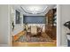 Formal dining room features a stylish chandelier, hardwood floors, and a classic china cabinet at 205 Sherman Pines Dr, Fuquay Varina, NC 27526