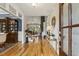 Open entryway with hardwood floors, a stone fireplace, and staircase at 205 Sherman Pines Dr, Fuquay Varina, NC 27526