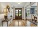 Hardwood floors with decorative table, light fixture, and dining room at 205 Sherman Pines Dr, Fuquay Varina, NC 27526