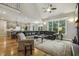Open-concept living room with soaring ceilings, fireplace, and access to kitchen and dining areas at 205 Sherman Pines Dr, Fuquay Varina, NC 27526