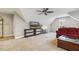 Upstairs living room with vaulted ceilings, large windows, and TV at 205 Sherman Pines Dr, Fuquay Varina, NC 27526
