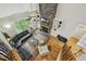 Spacious living room with large window, fireplace, hardwood floors and an area rug at 205 Sherman Pines Dr, Fuquay Varina, NC 27526
