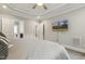 The main bedroom boasts a tray ceiling, ceiling fan, wall-mounted TV, and ensuite bathroom access at 205 Sherman Pines Dr, Fuquay Varina, NC 27526