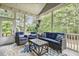 Inviting screened porch features comfortable seating and views of the landscaped backyard at 205 Sherman Pines Dr, Fuquay Varina, NC 27526