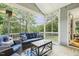The cozy screened porch is the perfect place to unwind and enjoy the outdoor scenery at 205 Sherman Pines Dr, Fuquay Varina, NC 27526