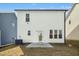Backyard features a lawn and a concrete patio accessible via a glass door at 21 Diploma Dr, Clayton, NC 27520