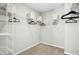 Walk-in closet featuring wire shelving providing ample storage space for clothing and accessories at 21 Diploma Dr, Clayton, NC 27520