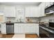 Modern kitchen features stainless steel appliances, granite countertops, and white cabinetry at 21 Diploma Dr, Clayton, NC 27520
