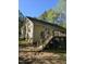 Home exterior featuring a back deck with stairs and a spacious yard at 2122 Sterling Creek Ln, Franklinton, NC 27525