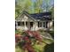 Inviting home with dark shutters, manicured lawn, and inviting entrance at 2122 Sterling Creek Ln, Franklinton, NC 27525