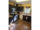 Functional kitchen with dark cabinets, granite countertops, and modern appliances at 2122 Sterling Creek Ln, Franklinton, NC 27525