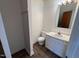The bathroom features a white vanity and updated flooring at 2146 Charles St # 12, Durham, NC 27707