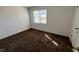 Bedroom with carpet floors, white walls and window with natural light at 2146 Charles St # 12, Durham, NC 27707