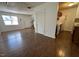Open-concept living space featuring hardwood floors, access to kitchen and staircase to bedrooms at 2146 Charles St # 12, Durham, NC 27707