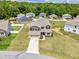 Aerial view of home with a beautiful lawn, and a two-car garage at 222 Trailing Oak Trl, Clayton, NC 27527