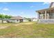 Expansive backyard featuring a covered porch, perfect for outdoor entertaining and relaxation at 222 Trailing Oak Trl, Clayton, NC 27527