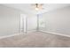 Cozy bedroom with a ceiling fan and access to another room at 222 Trailing Oak Trl, Clayton, NC 27527
