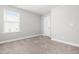 Comfortable bedroom with carpet, window, and neutral tones at 222 Trailing Oak Trl, Clayton, NC 27527
