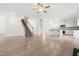 Modern kitchen with a large island, granite countertops, stainless steel appliances, and a tiled backsplash at 222 Trailing Oak Trl, Clayton, NC 27527