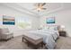 Comfortable main bedroom features a tray ceiling, a ceiling fan, and light decor at 222 Trailing Oak Trl, Clayton, NC 27527