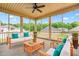 Inviting screened porch offering a relaxing outdoor living space, ceiling fan, and wooded views at 222 Trailing Oak Trl, Clayton, NC 27527