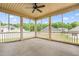 Spacious screened porch with neutral colors, ceiling fan, and a great view at 222 Trailing Oak Trl, Clayton, NC 27527