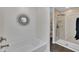 Bright bathroom featuring a walk-in shower and a tub for the ultimate relaxation experience at 231 Grindstone Dr, Apex, NC 27502