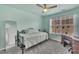 Light green bedroom featuring a window with blinds and a wardrobe, offering both style and function at 231 Grindstone Dr, Apex, NC 27502