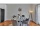Dining area with a modern table and chairs, unique wall decor, and natural light at 231 Grindstone Dr, Apex, NC 27502