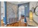 Inviting foyer featuring archway, hardwood floors, and an accent wall at 231 Grindstone Dr, Apex, NC 27502
