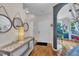 Foyer with hardwood floors, designer lighting and accent wall at 231 Grindstone Dr, Apex, NC 27502