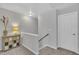 Upstairs hallway featuring neutral colors, stylish furniture, and a welcoming atmosphere at 231 Grindstone Dr, Apex, NC 27502