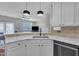 Bright kitchen with white cabinets and stainless steel dishwasher at 231 Grindstone Dr, Apex, NC 27502