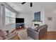 Cozy living room with fireplace, comfortable seating, and ample natural light at 231 Grindstone Dr, Apex, NC 27502