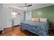 Well-lit bedroom with hardwood floors, ceiling fan, and great natural light at 2410 Overbrook Ln, Sanford, NC 27330