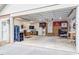 Spacious two-car garage with ample storage and organization, illuminated by bright lighting at 2410 Overbrook Ln, Sanford, NC 27330