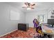 Home office space with a gray desk, white board, and hardwood floors at 2410 Overbrook Ln, Sanford, NC 27330