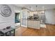 Bright kitchen with stainless steel appliances, granite countertops, and hardwood floors at 2410 Overbrook Ln, Sanford, NC 27330