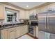 Spacious kitchen with stainless steel appliances, granite countertops, and a window at 2410 Overbrook Ln, Sanford, NC 27330